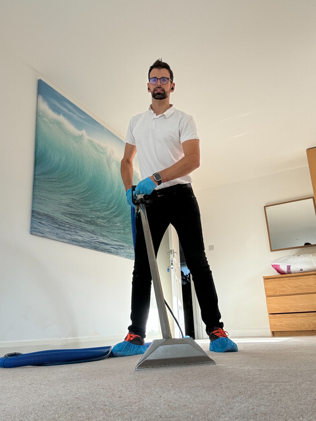 Viesturs, professional carpet cleaning technician in Chichester, with carpet cleaning equipment